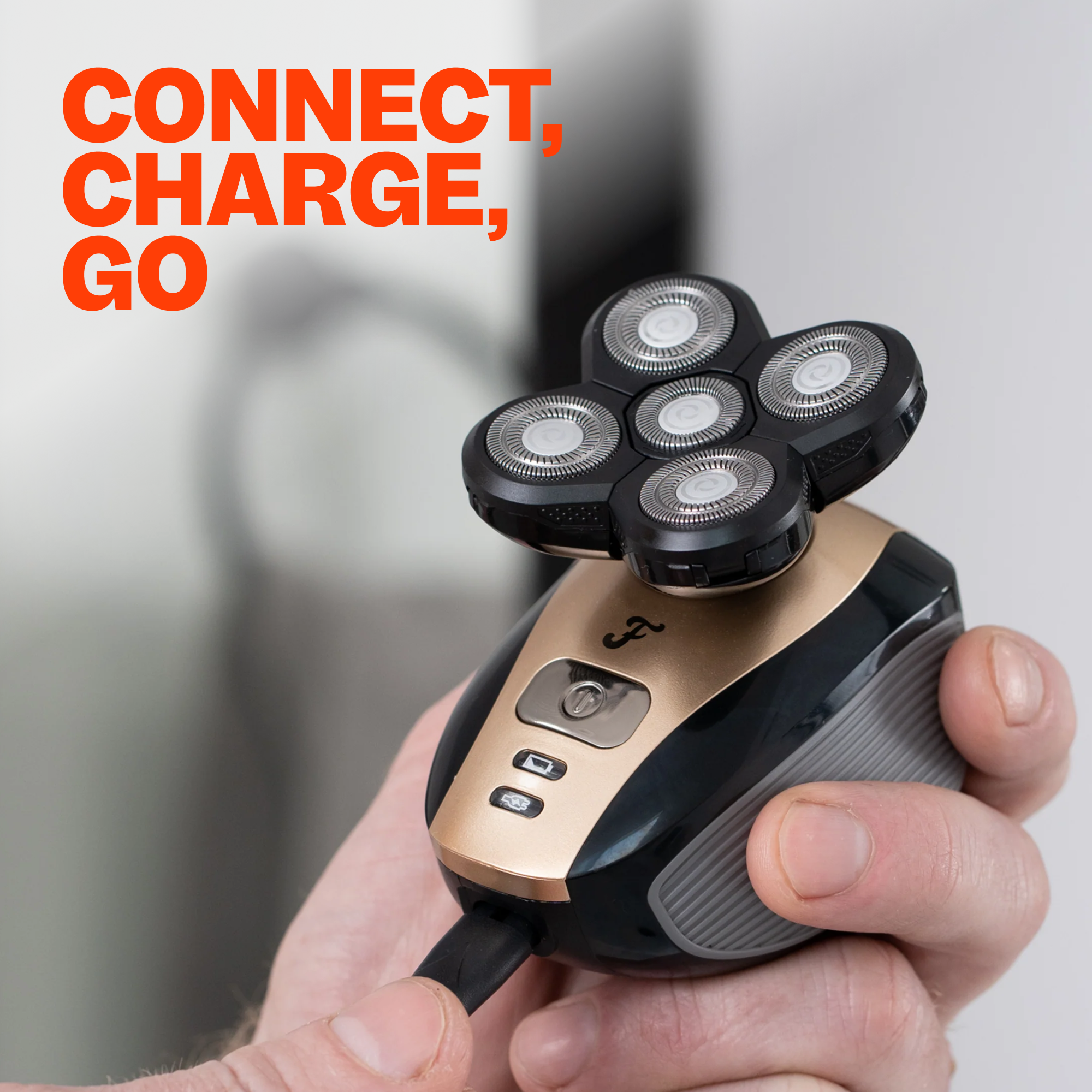 A hand holds a Freebird FlexSeries® USB Charging Cable with CONNECT, CHARGE, GO in bold orange text above.