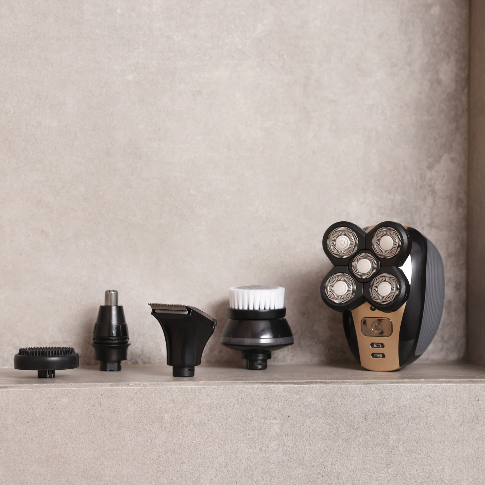 The FlexSeries® Shaving Kit by Freebird, featuring ScalpSafe™ Technology and four versatile attachments, elegantly displayed on a concrete surface.