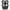 Close-up of a black electric shaver with four circular rotating blades arranged in a square formation.
