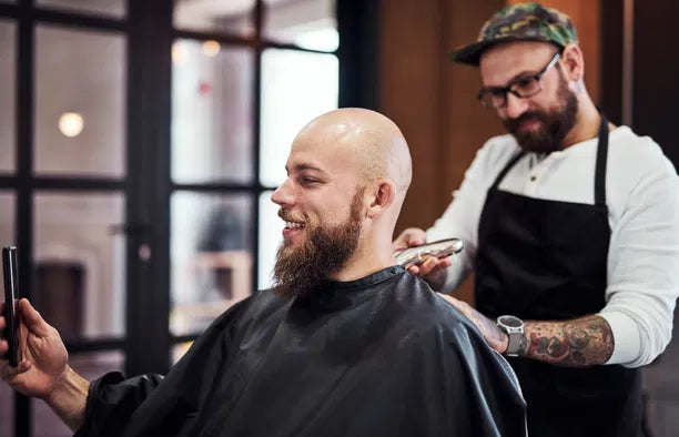 bald man getting a haircut