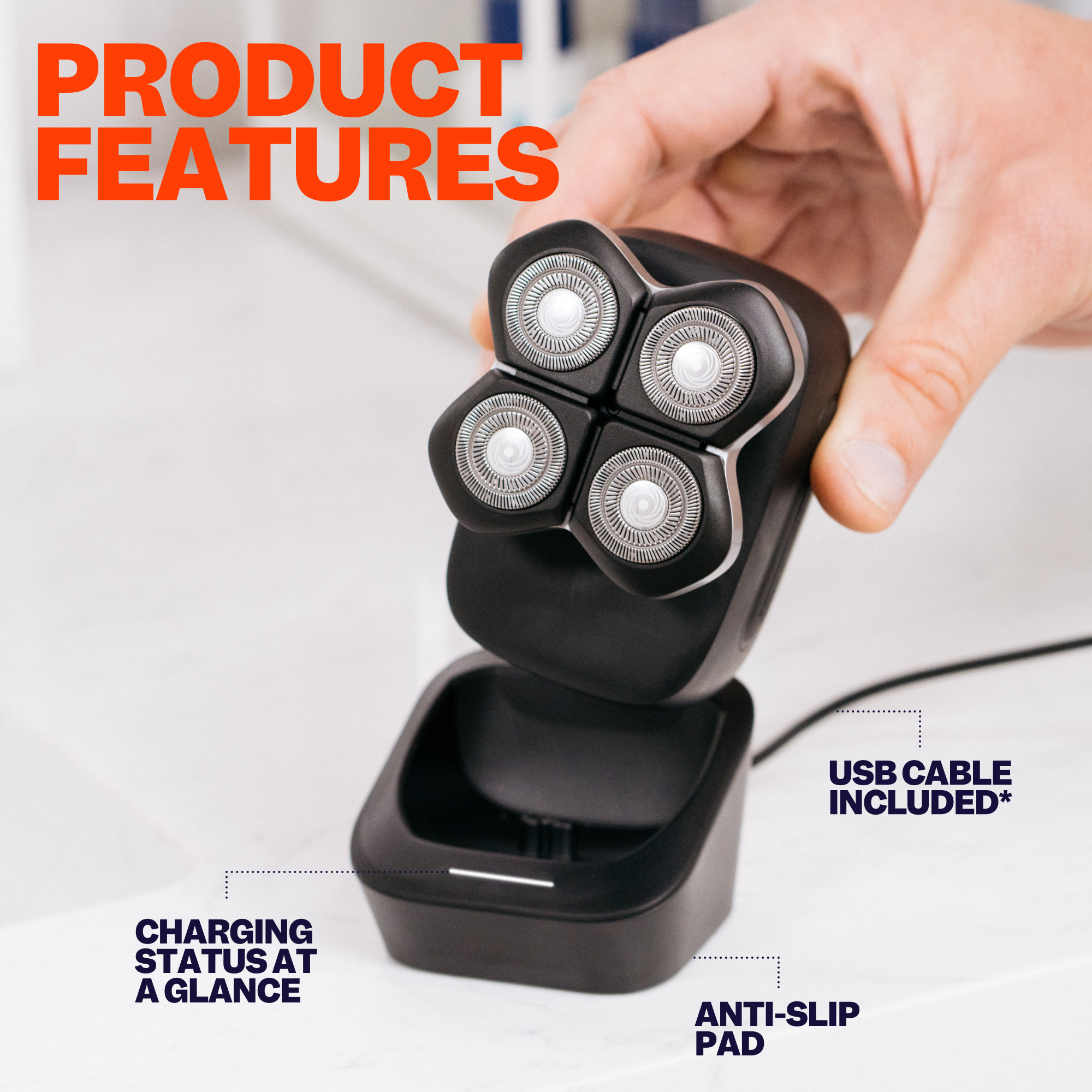 An individual holds a black electric shaver equipped with four rotary blades, an anti-slip pad, and a USB cable. The FlexSeries® Pro Charging Dock transforms your shaving area into an efficient station.
