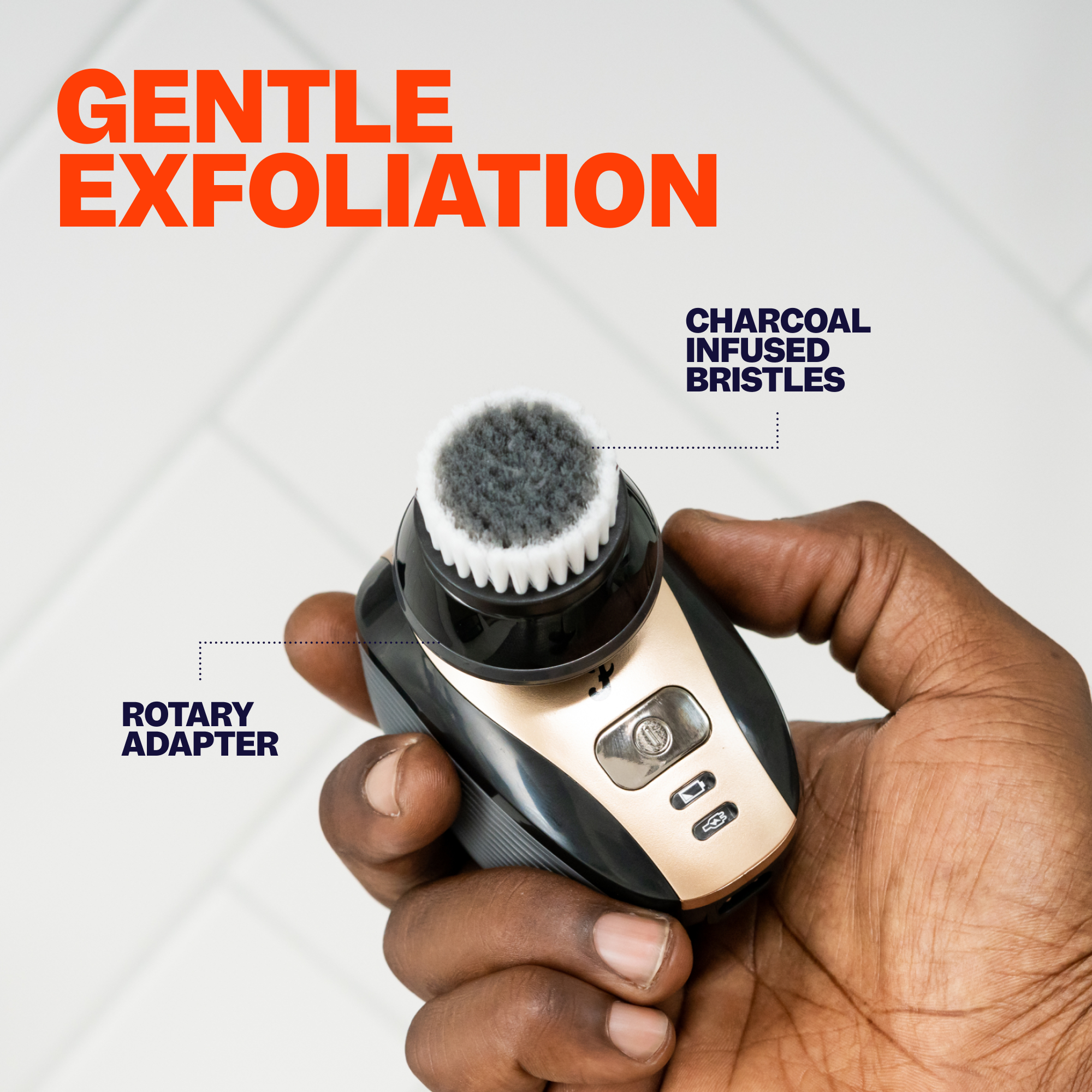 A hand holds the Exfoliation & Scalp Brush, featuring charcoal bristles and a rotary adapter, ideal for gentle scalp cleansing.